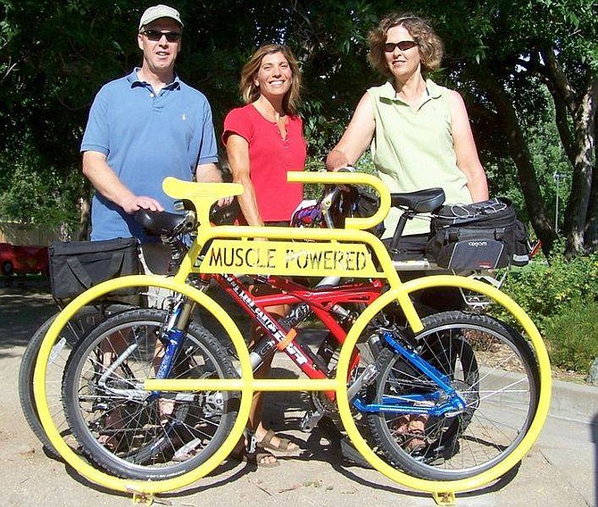 Clay and Susan McElhany with Anne McQuarie, president of Muscle Powered, right, at the Sunset Park bike rack.
