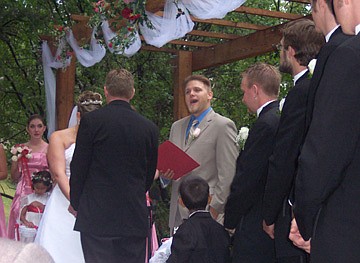 Jarid serves as the officiant at an outdoor wedding in Genesee, Colo.