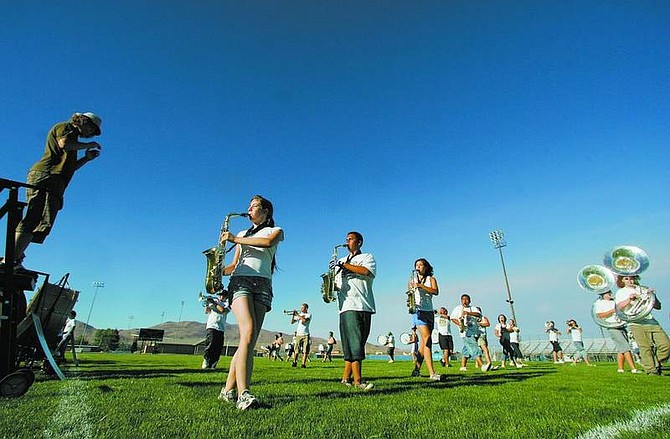 BRAD HORN/Nevada Appeal Carson High School&#039;s  Blue Thunder Marching band rehearses at the school&#039;s football field this afternoon. The band will celebrate the end of 12-hour practice days with a dessert concert at 7:30 p.m. Friday at the field. The public is invited. The field is on the east side of the school, 1111 N. Saliman Road.