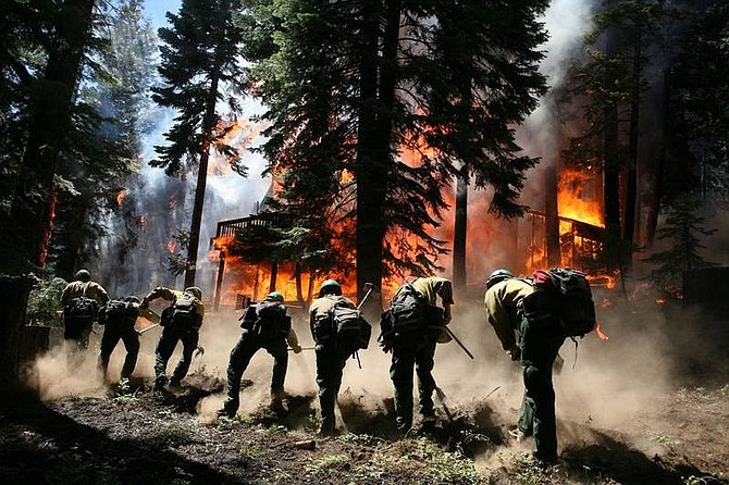 Ryan Salm, Sierra SunFirefighters work to contain the Washoe Fire, which broke out on the west shore of Lake Tahoe Saturday afternoon.
