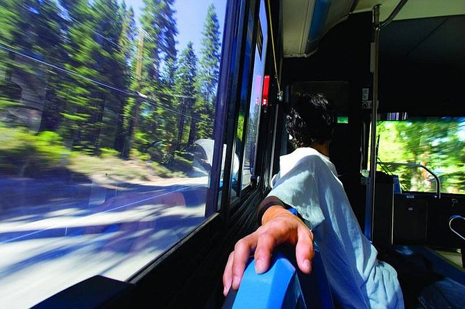 Photo by Jonah M. Kessel / Nevada Appeal News ServA Tahoe Area Regional Transit bus passenger rides from Tahoe City to Incline Village. The TART system was the most efficient of the transports used recently to travel around the lake.