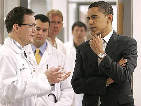 By Charlie Neibergall, APObama talks with Dr. Mark Anderson while touring a cardiology research lab before speaking about his health care plan May 29, 2007, at the University of Iowa in Iowa City.
