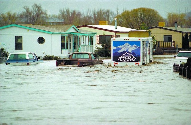 K.M. Cannon/Nevada Appeal file photo Water was up to the panels of this beer truck as it made its way down Parkland Avenue on Jan. 2, 1997.