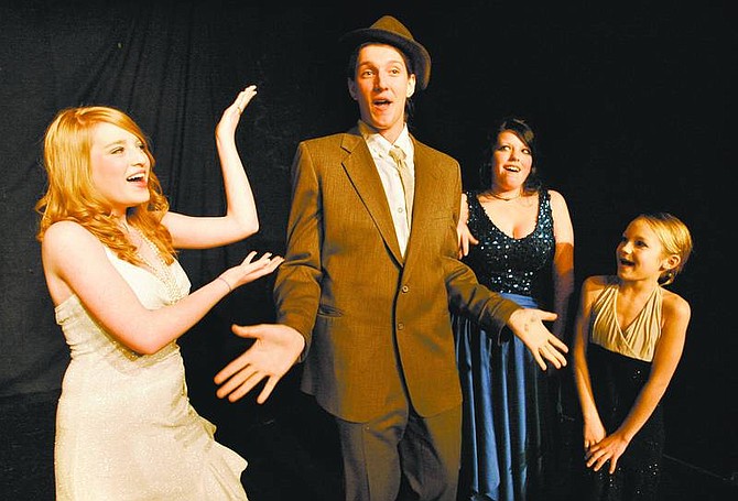Cathleen Allison/Nevada Appeal From left, Cameron Shirey rehearses with Monica Ricketts, Brynn Garrett and Heather Canfield at the Brewery Arts Center on Tuesday night. &quot;Bugsy Malone Jr.&quot;, featuring the BAC Stage Kids, will open Friday.