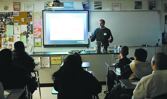 Chad Lundquist/Nevada Appeal Joe Leone, vice president of drilling and production for oil giant ConocoPhillips, talks to a Carson High School geology class Wednesday.