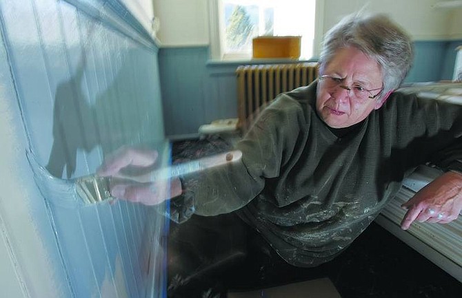 Chad Lundquist/Nevada Appeal Mimi Patrick, president of the board of trustees for St Mary&#039;s Art Center, repaints a wall in one of the rooms Wednesday at the historic Virginia City building.