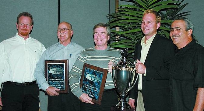Rhonda Costa-Landers/NEVADA APPEAL S&amp;S Motorsports team members, from left, John Stewart, co-owners Steve Shaw and Tom Silsby, driver Troy Regier, and Rick Barba, pose for a photo at the American Speed Association/Western States Supermodifieds awards banquet held in Reno.