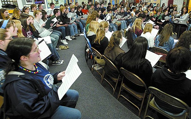 Carson High School senior Kiona Roath, left,  sings with the honor choir at Douglas High School during rehearsal Wednesday for tonight&#039;s performance of the Honor Choir at Douglas High.   Shannon Litz/ Nevada Appeal News Service