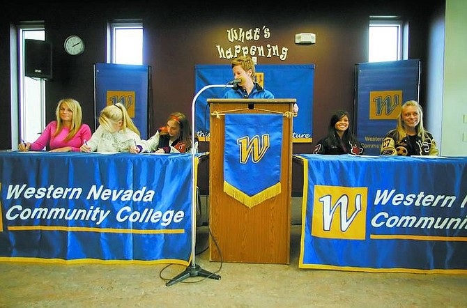 BRAD HORN/Nevada Appeal Western Nevada Community College head soccer coach Hillary Arthur watches as her new recruits sign letters of commitment to play on her team in 2007.