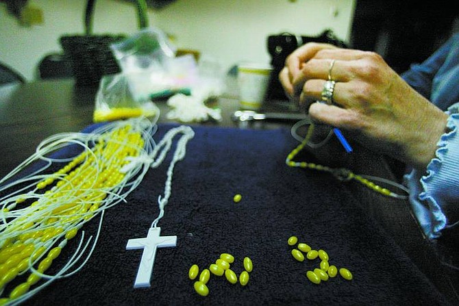 BRAD HORN/Nevada Appeal Cindy Pardini makes rosaries at Corpus Christi Catholic Church on Feb. 7