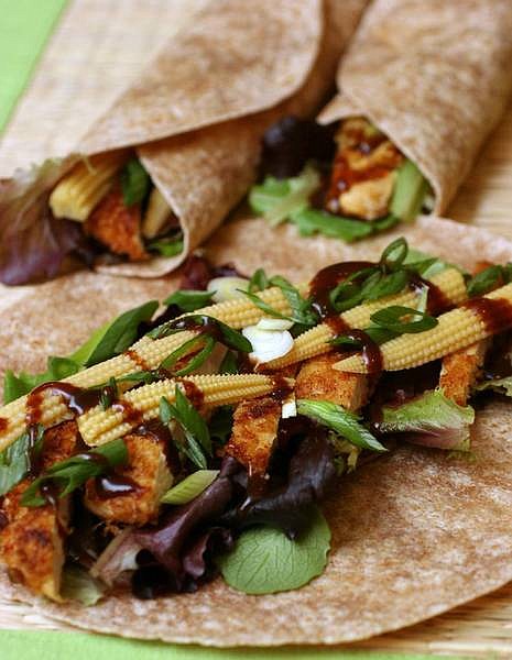 Larry Crowe/Associated Press Thin-cut and marinated chicken breast with a panko, or Japanese-style breadcrumb coating is the anchor for this Asian chicken wrap. The versatile recipe could easily be modified for a variety of other taste preferences, like Mexican.