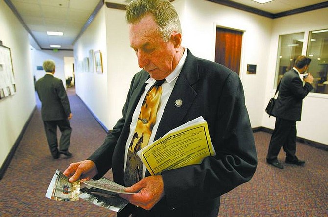 Cathleen Allison/Nevada Appeal Nevada Assemblyman John Carpenter, R-Elko, prepares to talk Tuesday morning, at the Legislature in Carson City about the ongoing graffiti problems at a park near his rural Nevada home. Carpenter was pushing for tougher penalties in a bill that would mandate lengthy community service sentences and loss of driving privileges for those convicted of vandalizing property with graffiti.