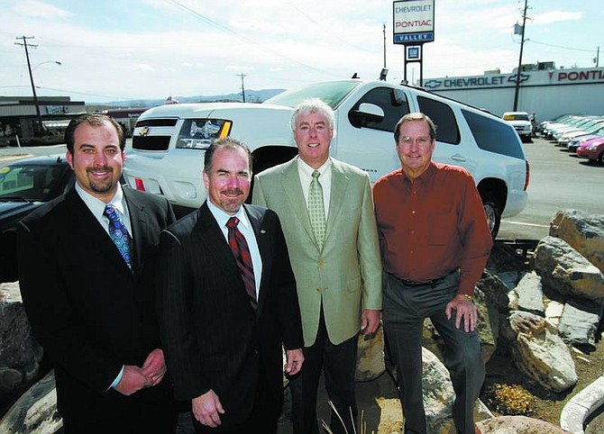 Chad Lundquist/Nevada Appeal Michael Hohl, president and owner of The Michael Hohl Automotive Group, signed a dealer agreement with General Motors on Wednesday afternoon. Left to right, Michael Hohl Jr.; Bob Hilgardner, western region zone manager for GM; Michael Hohl; and Ken Jochim, controller for Michael Hohl Automotive.