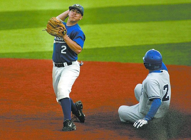 Cathleen Allison/Nevada Appeal Wildcat&#039;s Kyle Bondurant turns a double play against Joshua Chevalier of Salt Lake Community College during Friday&#039;s game at WNCC.