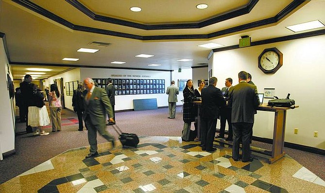 Cathleen Allison/Nevada Appeal Lobbyists gather at the Legislature on Wednesday morning. Floor sessions begin most weekdays at 11 a.m., attracting lobbyists to the entrances to both chambers.