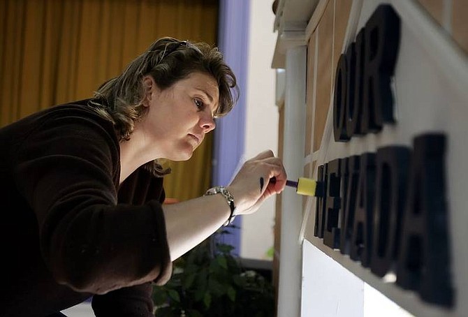 Chad Lundquist/Nevada Appeal Erin Lehman, interim executive director for the Children&#039;s Museum of Northern Nevada, works on &quot;Our Nevada,&quot; a new display that will focus on history, government and a host of other Silver State topics.