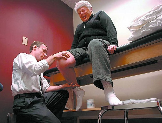 Andre F. Chung/The Baltimore Sun Marlene Freed, 68, is assisted by physical therapist Chris Gnip as she undergoes physical therapy.