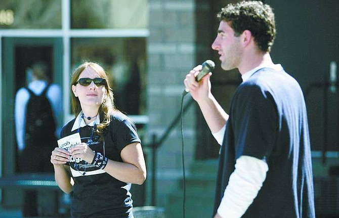 Cathleen Allison/Nevada Appeal Wolf Pack quarterback Jeff Rowe speaks at a rally last week in support of his cousin Sarah Ragsdale, left, who is running for president of the Associated Students of the University of Nevada, Reno. Ragsdale, a 2004 Carson High School graduate, is hoping to become only the sixth female president in the school&#039;s history.
