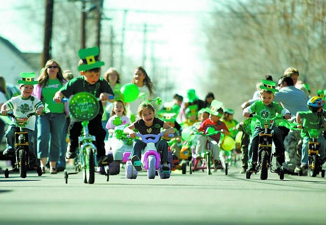 BRAD HORN/Nevada Appeal Kinderland day care students race on Curry Street during their annual St. Patrick&#039;s Day Parade on Friday.