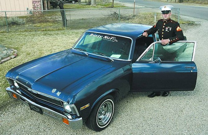 Cathleen Allison/Nevada Appeal U.S. Marine Corp. Steve Lubich stands with his 1972 Chevy Nova while home on leave Wednesday. The car, originally purchased by his dad, John, in 1972, was badly damaged in the New Year&#039;s flood of 2006. A number of local friends and businesses helped get it back in shape for Lubich.