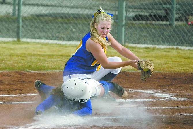 Cathleen Allison/Nevada AppealCarson&#039;s Katie McEwan gets tagged out by South Tahoe&#039;s Kelly Bartlett during Thursday&#039;s game at CHS. Carson won 10-0.
