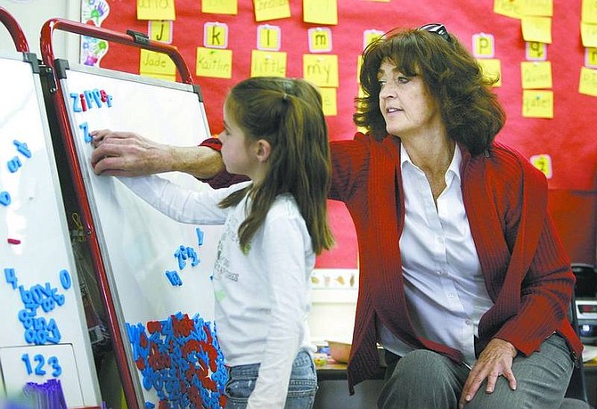 Cathleen Allison/Nevada Appeal  Hugh Gallagher Elementary School kindergartner Cierra Frisby, 5, spells in Connie Carlson&#039;s class on March 13. Carlson is retiring after 29 years of teaching in Virginia City.