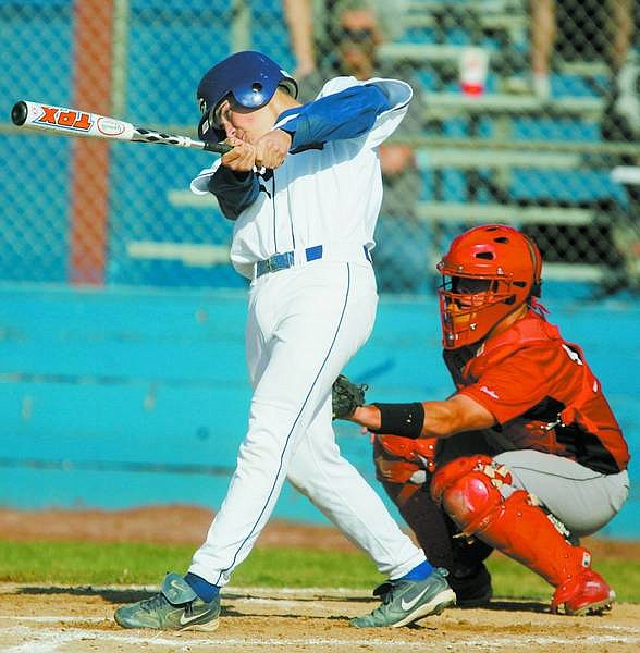 Brad Horn/Nevada Appeal Carson&#039;s Bryt Lewis follows through on his two-run single during the second inning against Wooster on Thursday. The Senators scored eight times in the second.