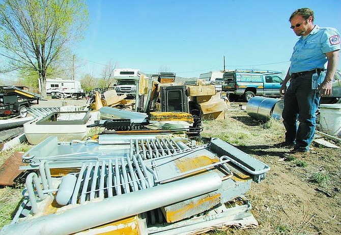 BRAD HORN/Nevada Appeal John Larson, owner of Nevada Mobile RV Service, looks over some of the Dometic Corporation refrigerators at his Johnson Lane home Thursday.