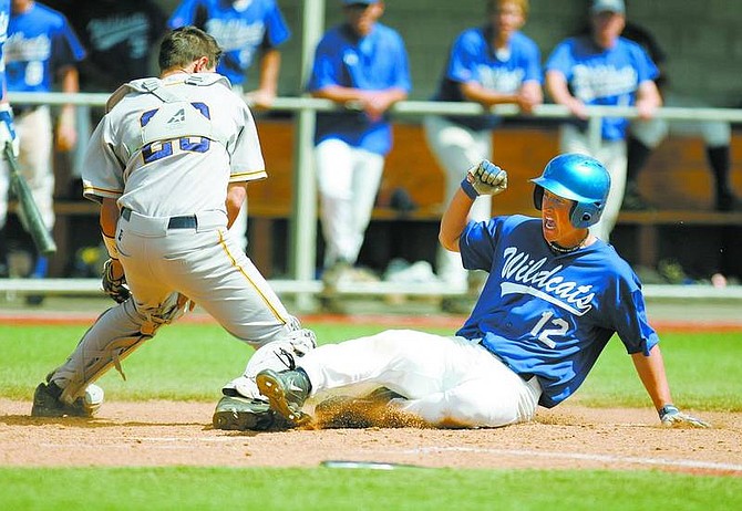 BRAD HORN/Nevada Appeal WNCC&quot;s Kevin Schlange scroes at John L. Harvey Field on Saturday.