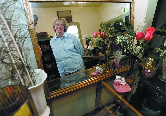 Chad Lundquist/Nevada Appeal Susan Ballew, owner of White Cat Antiques at 512 N. Curry Street, plans to have the shop open by Wednesday. It will be open  10 a.m. to 5 p.m. Wednesday through Saturday.