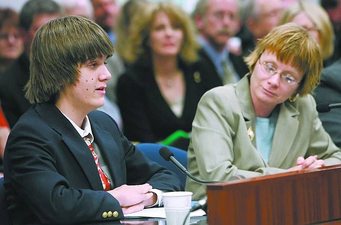 Chad Lundquist/Nevada Appeal Cliff Schumacher, left, testifies Monday before the Assembly Health and Human Services Committee on AB525 that would grant $6.4 million to help battle autism in Nevada. The 16-year-old, along with his mother Washoe County Family Court Judge Deborah Schumacher, right, and several dozen autism advocates filled the hearing room in support of the bill at the Legislature.