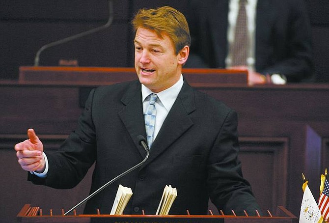 U.S. Rep. Dean Heller, R-Nev., speaks to the Legislature on Tuesday. Heller echoed President Bush on Tuesday in telling Nevada lawmakers that congressional Democrats are being &quot;reckless&quot; in setting a timeline for a withdrawal of U.S. troops from Iraq.  Cathleen Allison/ Nevada Appeal