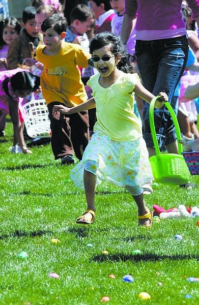 Chad Lundquist/Nevada Appeal Aishwarya Anand, 5, dashes forward to collect her share of the 20,000 brightly colored Easter eggs placed on Governor&#039;s Field Sunday afternoon. It only took four minutes for the 3,500 children to gather what took volunteers more than an hour to disperse.