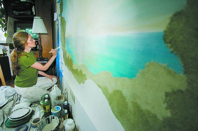 BRAD HORN/Nevada Appeal Lori Nourse paints a mural for a Reno client at her Carson City home on Wednesday.