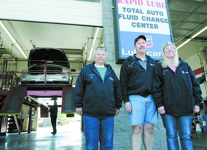 Chad Lundquist/Nevada Appeal Classic Lube &amp; Oil owners, from left, Janet Hutchinson, Brian Sandness and Elizabeth Sandness at their 1861 E. College Parkway shop.