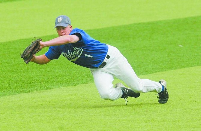 BRAD HORN/Nevada Appeal Cliff Shepard makes a diving catch in left field during the second game of the Western Nevada Community College Wildcat&#039;s doubleheader at John L. Harvey Field on Saturday.