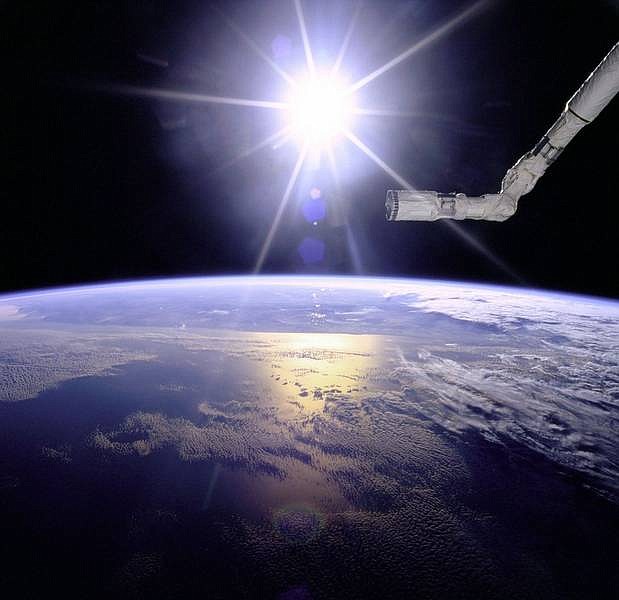 Courtesy of Earth Sciences and Image Analysis Laboratory/NASA Johnson Space Center This photo released by NASA shows a sunburst view of the Space Shuttle&#039;s robot arm over a cloudy Earth taken June 1,1996, during the flight of Space Shuttle Endeavour.