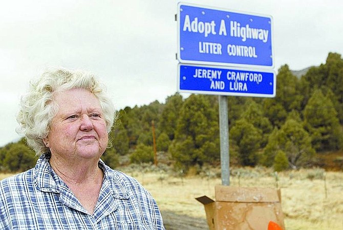 Shannon Litz/Appeal News Service Lura Morrison stands on Highway 395 south of Pine Valley Road where, until a recent disagreement with the state, she picked up garbage since 1978.
