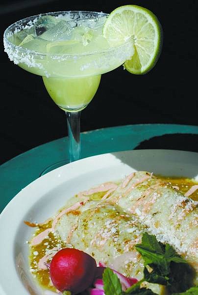 Chad Lundquist/Nevada Appeal Achiote Pork Enchiladas with green chili-tomatillo sauce by Brian Shaw of Cafe del Rio in Virginia City.