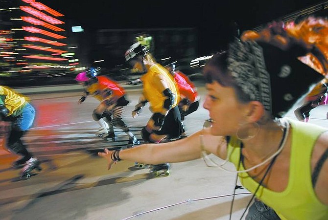 Chad Lundquist/Nevada Appeal Kristina Tarleton, aka &quot;Sailor Doom,&quot; coach for the Battle Born Derby Demons pushes her girls during practice in downtown Reno on Tuesday night. The team has scheduled its first contest set for May 19 against a team from Utah at a site to be determined in Reno.