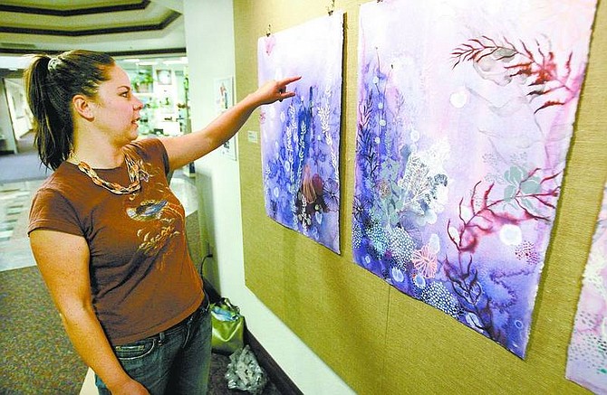 Trevor Clark/Nevada Appeal Artist Heather Patterson talks Friday about her artwork now on display at the Legislature.
