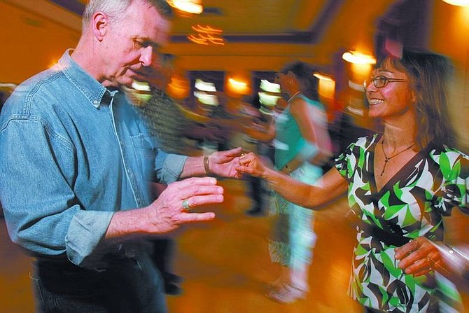 photos by Trevor Clark/Nevada Appeal Alan Mills and Sally Rogers, of Carson City, dance at the High Sierra Swing Dance Club&#039;s first dance at the Brewery Arts Center Friday night.