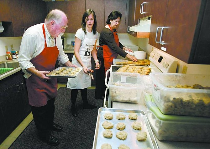 Cathleen Allison/Nevada Appeal Ben Graham, with the Clark County District Attorney&#039;s office, makes cookies Thursday at the Legislature. Graham, his wife Elana and their daughter Elana-Lee baked and distributed 1,400 cookies on Cookie Day, a traditional part of the Legislative session for more than 10 years.