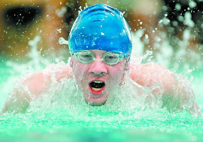 BRAD HORN/Nevada Appeal Carson&#039;s Kevin Dyer, 17, competes in the butterfly leg of the 200 meter team relay at the Carson Aquatic Center during the Zone Finals on Saturday.