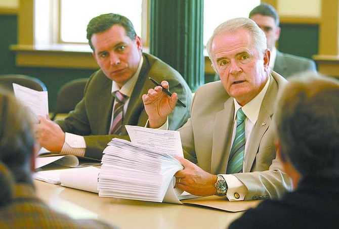 Cathleen Allison/Nevada Appeal Nevada Gov. Jim Gibbons, right, talks during a Board of Examiners meeting Tuesday at the Capitol. Secretary of State Ross Miller is at left.