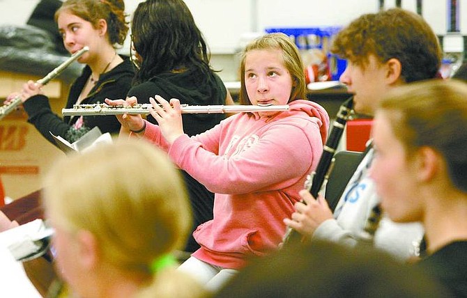 Cathleen Allison/Nevada Appeal Tabitha Howk, 14, plays the flute with the Carson Middle School band Tuesday morning. The band took first-place in its division and first-place overall at the Music in the Parks competition in Santa Clara, Calif., onFriday.