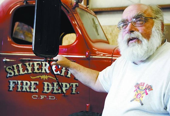 Chad Lundquist/Nevada Appeal Historian Larry Steinberg shares the history of the Silver City Volunteer Fire Department at the station during a lecture on Sunday. The lecture was part of Historic Preservation Month activities.
