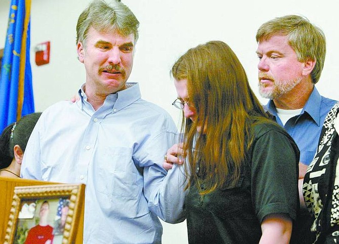 Cathleen Allison/Nevada Appeal Family members of Sgt. Anthony Schober, who was killed in Iraq on Saturday, spoke briefly at a press conference Friday.  Schober&#039;s father, Edward Schober, left, comforts his daughter Rebecca and his brother Robert.