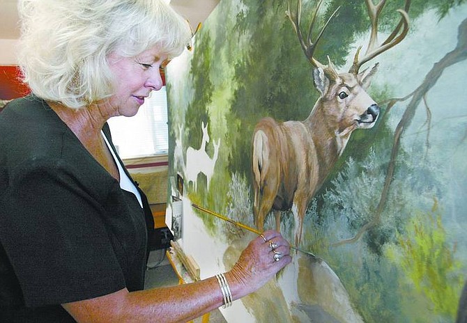 Cathleen Allison/Nevada Appeal Artist Kathy Hammill is currently working on several murals for the Topaz Lodge.
