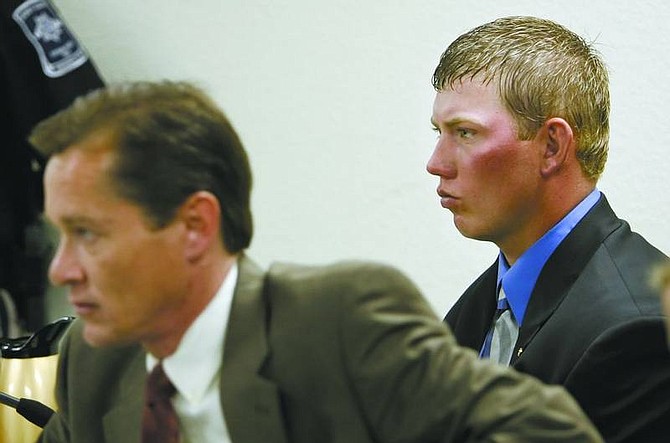 Chad Lundquist/Nevada Appeal Attorney Kenneth Stover listens to testimony in Storey County Justice Court on Monday while his client, Randy Boyd, watches. Boyd was bound over to district court for his part in an accident that killed a 16-year-old in December.